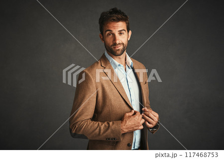 Confident, man and fashion portrait in studio with stylish, trendy and elegant smart suit as Professor. Smile, male person and luxury wealth in designer outfit with pride on grey background Confident, man and fashion portrait in studio with stylish, trendy and elegant smart suit as Professor. Smile, male person and luxury wealth in designer outfit with pride on grey background 117468753