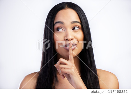 Woman, quiet and secret for hair care in studio with salon aesthetic and healthy scalp for growth. Model girl, keratin shine and silence emoji with thinking for texture ideas by white background Woman, quiet and secret for hair care in studio with salon aesthetic and healthy scalp for growth. Model girl, keratin shine and silence emoji with thinking for texture ideas by white background 117468822