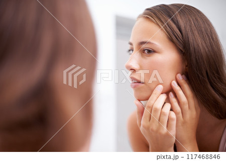 Face, beauty and inspection with woman in bathroom of home for skincare, cosmetics or mirror. Aesthetic, wellness and skin pimple with confident young person in apartment closeup for dermatology 117468846