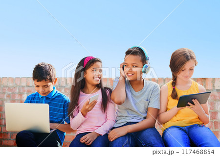School kids, outdoor and phone, tablet and laptop with diversity, bonding and streaming on web. Girl, boy and friends group with mockup space for tech, games and subscription on app at academy 117468854