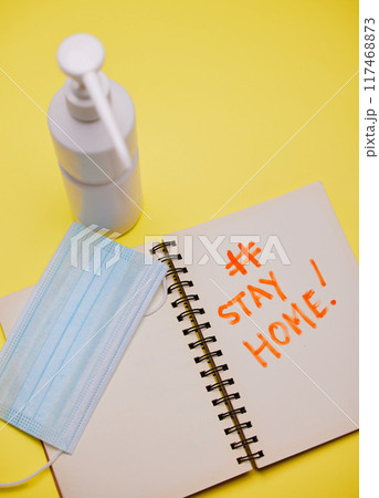 Flat lay, sanitizer and face mask with notebook for healthcare, wellness and safety. Virus, prevention and protection in studio with paper or diary by yellow background for rules and regulations Flat lay, sanitizer and face mask with notebook for healthcare, wellness and safety. Virus, prevention and protection in studio with paper or diary by yellow background for rules and regulations 117468873