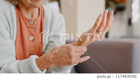 Medical, wrist pain and senior person with arthritis, osteoporosis and fibromyalgia on sofa. Home, lounge and woman with hands massage for discomfort, bruise muscle and carpal tunnel in retirement Medical, wrist pain and senior person with arthritis, osteoporosis and fibromyalgia on sofa. Home, lounge and woman with hands massage for discomfort, bruise muscle and carpal tunnel in retirement 117469500