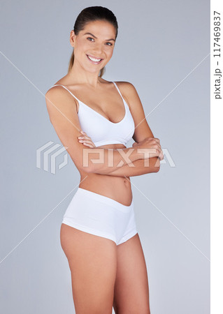 Studio portrait, woman and fitness with arms folded, confidence and happy for transformation. Underwear, wellness and healthy for weight loss, diet and results and athlete by white background 117469837