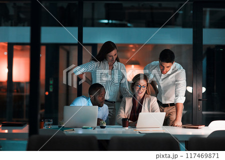 Team, laptop and business people in office at night with stock market charts for corporate investment. Discussion, computer and financial advisors working on company profit report with deadline. Team, laptop and business people in office at night with stock market charts for corporate investment. Discussion, computer and financial advisors working on company profit report with deadline. 117469871