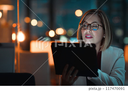 Corporate woman, tablet and productivity at night for company agenda, research and planning. Executive, technology and reading email or report for business results, growth and revenue in office Corporate woman, tablet and productivity at night for company agenda, research and planning. Executive, technology and reading email or report for business results, growth and revenue in office 117470091