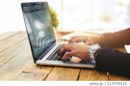 Hands, laptop and typing in office at desk for crypto, trading on stock market with financial. Computer, person and working at table for blockchain technology, internet communication for business 117470120