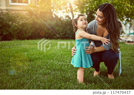 Smile, woman and baby with love in backyard for outdoor fun, growth and support in child development. Family, toddler girl and mom with happiness in nature for bonding, care and motherhood on weekend 117470437
