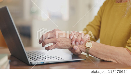 Arthritis, wrist pain and senior person with laptop after typing, browsing and scrolling in home. Desk, computer and hands with osteoporosis, bruise muscle and carpal tunnel as crisis in house Arthritis, wrist pain and senior person with laptop after typing, browsing and scrolling in home. Desk, computer and hands with osteoporosis, bruise muscle and carpal tunnel as crisis in house 117470634