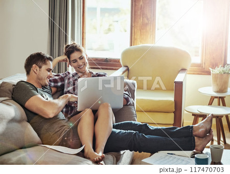 Couple, laptop and couch in living room, paperwork and document of loan, marriage and home in weekend and morning. House, man and woman on sofa, bills and together in lounge, cozy and happiness Couple, laptop and couch in living room, paperwork and document of loan, marriage and home in weekend and morning. House, man and woman on sofa, bills and together in lounge, cozy and happiness 117470703