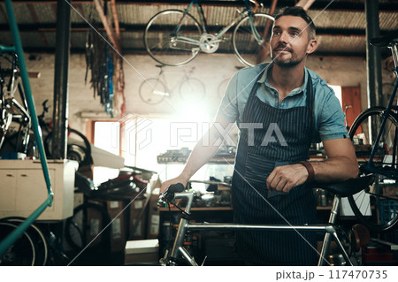 Man, bicycle shop and thinking for maintenance work, startup with transport service. Bike, mechanic and Male entrepreneur in workshop with idea, thoughtful for sustainable business with apron Man, bicycle shop and thinking for maintenance work, startup with transport service. Bike, mechanic and Male entrepreneur in workshop with idea, thoughtful for sustainable business with apron 117470735