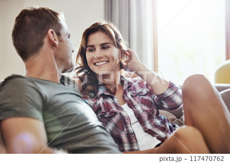 Couple, love and relax on sofa with smile at home for support, happiness and care in marriage. Peace, calm and man with woman on couch in living room for weekend, romance and bonding together Couple, love and relax on sofa with smile at home for support, happiness and care in marriage. Peace, calm and man with woman on couch in living room for weekend, romance and bonding together 117470762