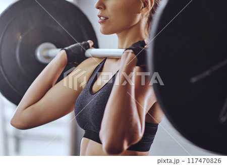 Gym, woman and weight lifting with barbell for workout, strength and muscle endurance for wellness. Female bodybuilder, resilience and body goals with training, exercise and fitness progress 117470826