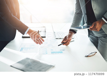 Planning, statistics and hands of business people in office with paperwork, tablet and charts. Meeting, graphs and teamwork in conference room for growth, development and project management at desk 117470899