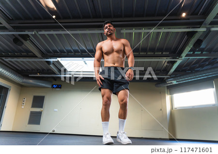 Shirtless latino male with muscular body at the gym 117471601