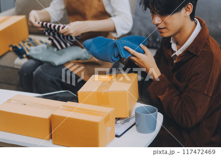 Small business owners couple entrepreneurs working with parcel, e-business, marketing, online shop, sme, entrepreneurs 117472469