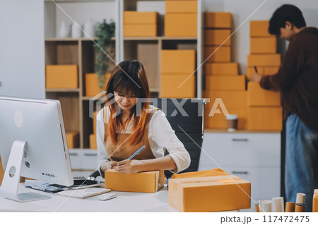 Small business owners couple entrepreneurs working with parcel, e-business, marketing, online shop, sme, entrepreneurs Small business owners couple entrepreneurs working with parcel, e-business, marketing, online shop, sme, entrepreneurs 117472475