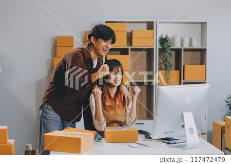 Small business owners couple entrepreneurs working with parcel, e-business, marketing, online shop, sme, entrepreneurs Small business owners couple entrepreneurs working with parcel, e-business, marketing, online shop, sme, entrepreneurs 117472479