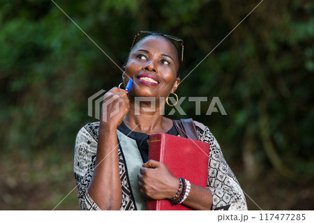 close up of young woman, smiling. close up of young woman, smiling. 117477285