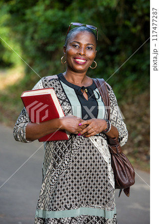portrait of young woman, smiling. 117477287