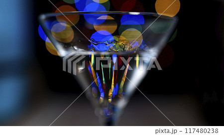 Dry martini against background of bokeh Dry martini against background of bokeh 117480238