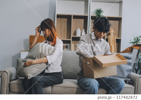 Offended couple ignoring each other after quarrel indoors, selective focus. Relationship problems Offended couple ignoring each other after quarrel indoors, selective focus. Relationship problems 117482672