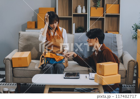 Small business owners couple entrepreneurs working with parcel, e-business, marketing, online shop, sme, entrepreneurs 117482717