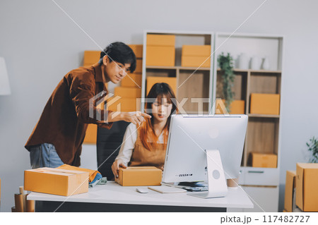 Small business owners couple entrepreneurs working with parcel, e-business, marketing, online shop, sme, entrepreneurs Small business owners couple entrepreneurs working with parcel, e-business, marketing, online shop, sme, entrepreneurs 117482727