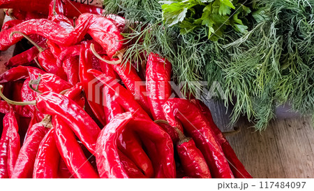 Freshly picked hot chilies are sold at the outdoor farmers market 117484097