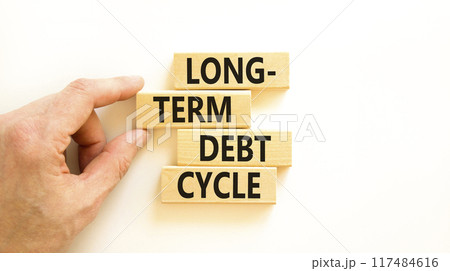 Long-term debt cycle symbol. Concept words Long-term debt cycle on beautiful wooden block. Beautiful white table white background. Businessman hand. Business Long-term debt cycle concept. Copy space. Long-term debt cycle symbol. Concept words Long-term debt cycle on beautiful wooden block. Beautiful white table white background. Businessman hand. Business Long-term debt cycle concept. Copy space. 117484616