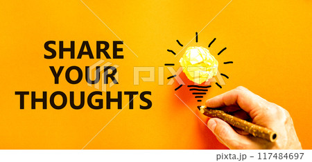 Share your thoughts symbol. Concept words Share your thoughts on beautiful orange paper. Beautiful orange background. Light bulb. Businessman hand. Business share your thoughts concept. Copy space. 117484697