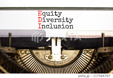 EDI equity diversity inclusion symbol. Concept words EDI equity diversity inclusion typed on retro typewriter. Beautiful white background. Business EDI equity diversity inclusion concept. Copy space. EDI equity diversity inclusion symbol. Concept words EDI equity diversity inclusion typed on retro typewriter. Beautiful white background. Business EDI equity diversity inclusion concept. Copy space. 117484707