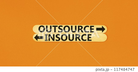 Outsource or insource symbol. Concept word Outsource or Insource on beautiful wooden stick. Beautiful orange table orange background. Business outsource insource concept. Copy space. Outsource or insource symbol. Concept word Outsource or Insource on beautiful wooden stick. Beautiful orange table orange background. Business outsource insource concept. Copy space. 117484747