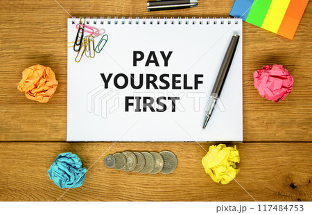 Pay yourself first symbol. Concept words Pay yourself first on beautiful white note. Beautiful wooden background. Black pen. Colored paper. Business and pay yourself first concept. Copy space. Pay yourself first symbol. Concept words Pay yourself first on beautiful white note. Beautiful wooden background. Black pen. Colored paper. Business and pay yourself first concept. Copy space. 117484753
