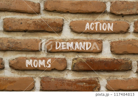 Moms demand action symbol. Concept words Moms demand action on red bricks on a beautiful brick wall background. Business, finacial and Moms demand action concept. Copy space. Moms demand action symbol. Concept words Moms demand action on red bricks on a beautiful brick wall background. Business, finacial and Moms demand action concept. Copy space. 117484813