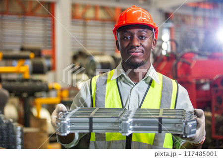 Male african american workers wear red helmet Male african american workers wear red helmet 117485001