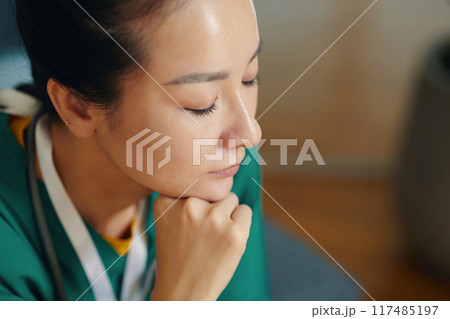 Reflecting Nurse Deep in Thought in Hospital Environment Reflecting Nurse Deep in Thought in Hospital Environment 117485197