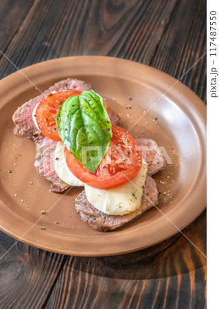 Caprese beef steak 117487550
