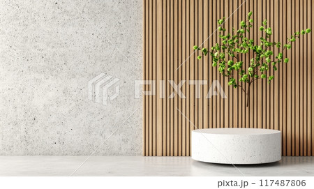 Simple decor featuring a round table with a vase and blossoming branch against a wooden wall 117487806