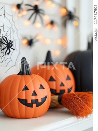 Cheerful Halloween decor with carved pumpkins and bats in a cozy indoor setting Cheerful Halloween decor with carved pumpkins and bats in a cozy indoor setting 117487902