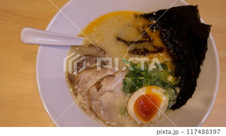 A bowl of Buta Tonkotsu Ramen Noodles is a fatty pork broth, fresh noodles, soft-yolk eggs, and tender pork belly that melts in the mouth with some dried seaweed toppings. A bowl of Buta Tonkotsu Ramen Noodles is a fatty pork broth, fresh noodles, soft-yolk eggs, and tender pork belly that melts in the mouth with some dried seaweed toppings. 117488397
