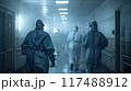 Healthcare workers wearing protective suits in hospital corridor during a crisis 117488912