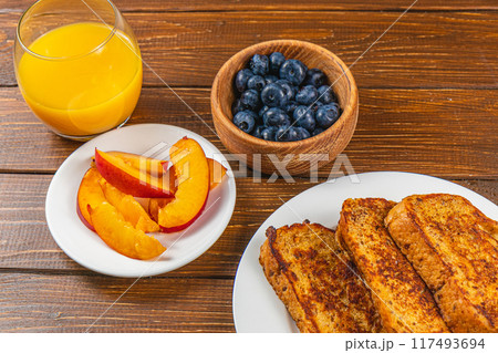 french toast on white plate for breakfast 117493694