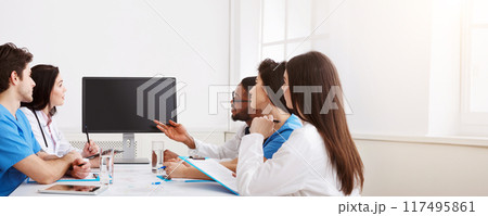 Remote Medicine. Team of Doctors Parsing Difficult Case From Patient By Video Link Remote Medicine. Team of Doctors Parsing Difficult Case From Patient By Video Link 117495861