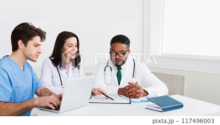 Medical Education. Interns Meeting With Mentor And Taking Notes At Hospital 117496003