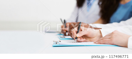 Medical Education. Doctors Writing On Paper At Conference In Hospital Medical Education. Doctors Writing On Paper At Conference In Hospital 117496771