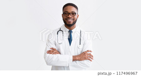 Happy Doctor In White Uniform Against Light Background With Copy Space, Panorama Happy Doctor In White Uniform Against Light Background With Copy Space, Panorama 117496967