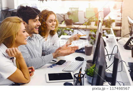 Innovative Professionals Engaged in Project Discussion: Enthusiastic, innovative professionals deeply engaged in discussion over project strategies in a futuristic, tech-oriented office Innovative Professionals Engaged in Project Discussion: Enthusiastic, innovative professionals deeply engaged in discussion over project strategies in a futuristic, tech-oriented office 117498567