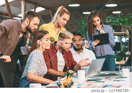 Startup concept. Young colleagues working on new project in modern office, copy space 117498790