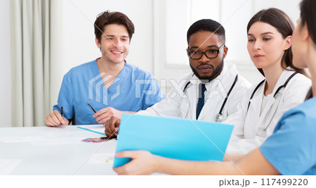 Medical Staff Having Discussion In Modern Hospital Meeting Room Medical Staff Having Discussion In Modern Hospital Meeting Room 117499220