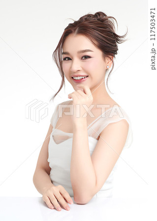 Beautiful young asian woman with clean fresh skin on white background, Face care, Facial treatment, Cosmetology, beauty and spa, Asian women portrait. Beautiful young asian woman with clean fresh skin on white background, Face care, Facial treatment, Cosmetology, beauty and spa, Asian women portrait. 117503471